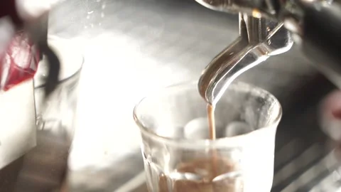 Coffee brewing machine pours into glasses Stock Footage 260213060
