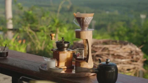 Coffee brewing setup with grinder and drip filter scenic natural background Stock Footage 317007957