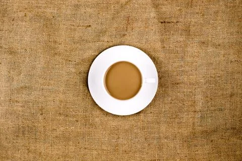 Coffee on a brown, structured background Stock Photos