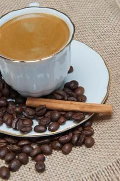 Coffee on a burlap background. Stock Photos