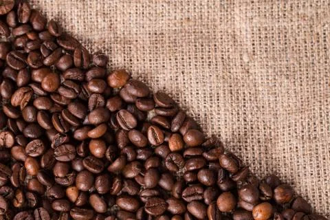 Coffee on burlap sack background Stock Photos