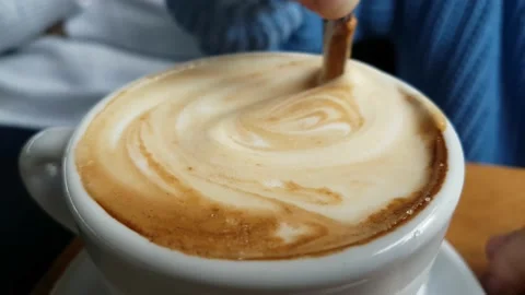 Coffee cafe capuccino stirring in cup Stock Footage 237491700