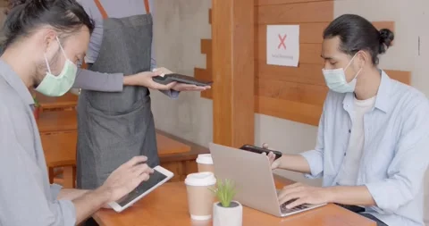 Coffee café space, waitress serving and paying credit by phone Stock Footage 146026070