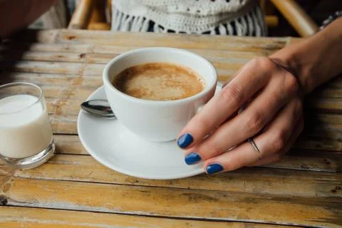 Coffee cappuccino on a bamboo table Stock Photos
