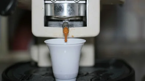 Coffee capsule pod machine make espresso in a plastic cup for breakfast,caffeine Video stock 153632583