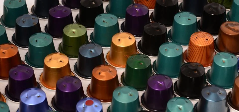 Coffee capsules background Stock Photos