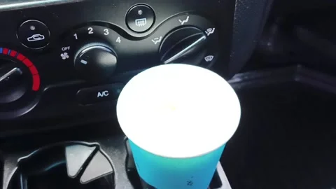 Coffee in the car. coffee cup. driver holding coffee Stock Footage 212661358
