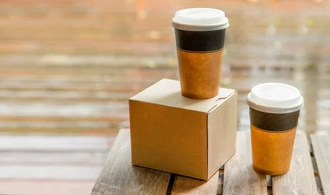 Coffee in cardboard brown cups ordered and delivered for takeaway, food delivery Stock Photos