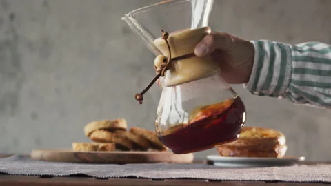 Coffee in a chemex jar with coffee inside on a wooden table on a coffee shop Stock Footage 140196989