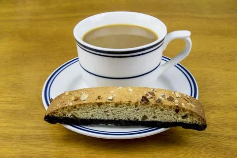 Coffee with a chocolate biscotti Foto stock