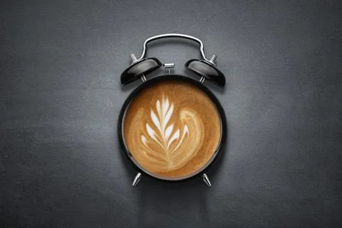Coffee clock on dark concrete background with copy space Stock Photos
