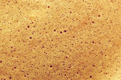 Coffee close up background, view from the top on natural foam. Stock-Fotos