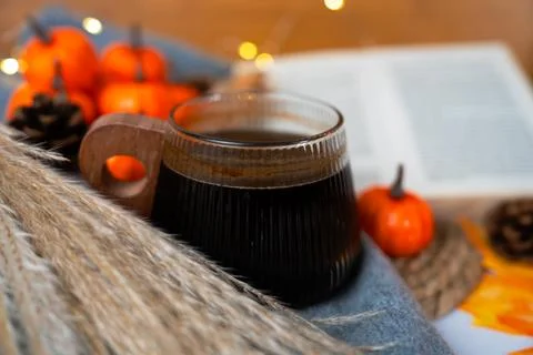 Coffee close-up with open book and autumn accents Stock Photos