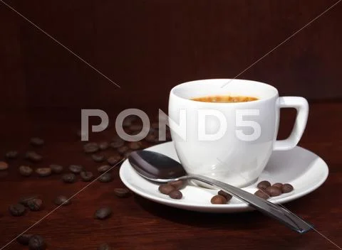 Coffee with coffee-beans Stock Photos