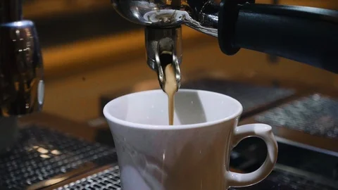 Coffee coming out of the coffee machine Stock Footage 98855957