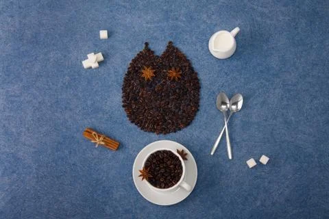 Coffee composition owl cup of coffee milk sugar spoons cinnamon Stock Photos