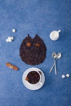 Coffee composition owl cup of coffee milk sugar spoons cinnamon Stock Photos
