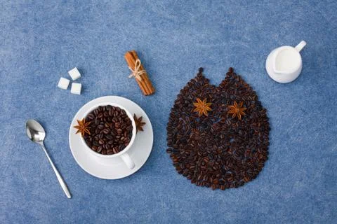 Coffee composition owl cup of coffee milk sugar spoons cinnamon Stock Photos