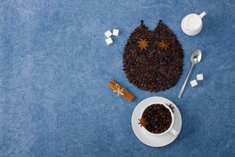 Coffee composition owl cup of coffee milk sugar spoons cinnamon Stock Photos