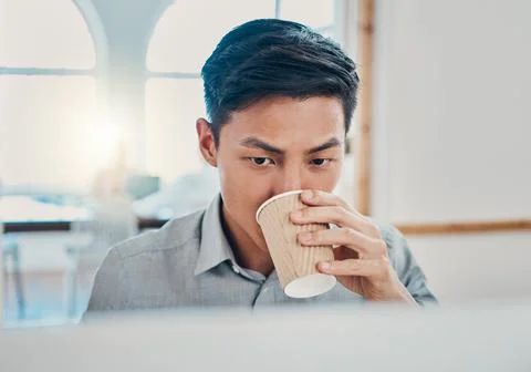 Coffee, computer and commitment with a businessman working in a corporate office Foto stock