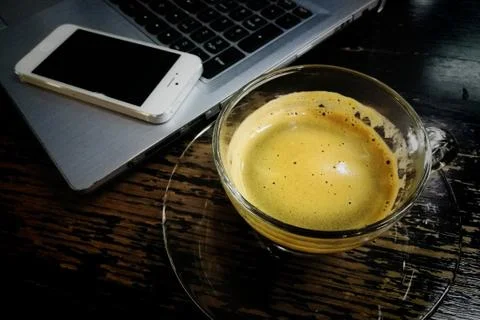 Coffee, computer, smartphone on table Stock Photos