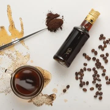 Coffee concept with coffee in cup, coffee beans and irish cream syrup isolate 写真素材