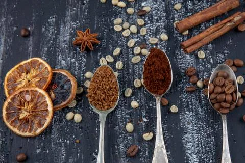 Coffee concept. Top view of three different varieties of coffee beans on dark Foto stock