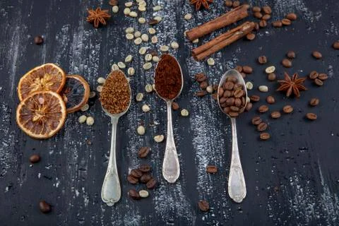 Coffee concept. Top view of three different varieties of coffee beans on dark Foto stock