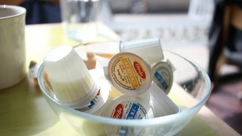 Coffee creamer hand Stock Footage 123614922