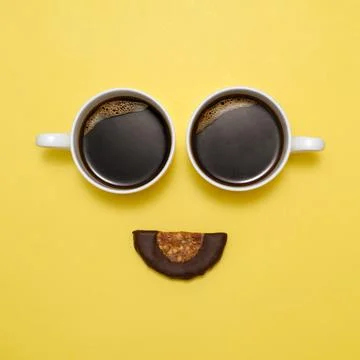 Coffee creative happy face with two cups. Top view, flat lay 写真素材