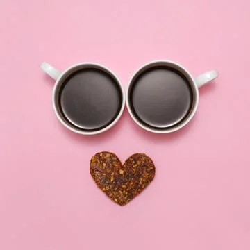 Coffee creative love face with two cups. Top view, flat lay Stock Photos