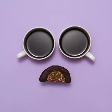 Coffee creative sad face with two cups. Top view, flat lay Foto stock