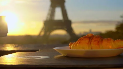 Coffee with croissant on backdrop of Eiffel Tower Stock Footage 122995445