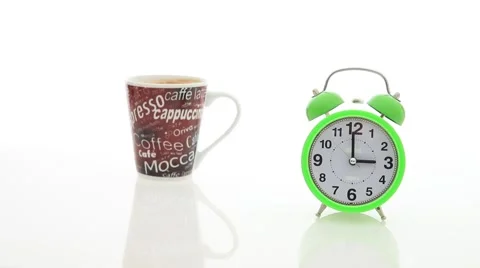 Coffee cup and alarm clock isolated Stock Footage 67646653