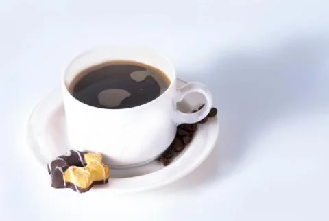 Coffee cup and beans on old kitchen table. Top view with copyspa Stock Photos
