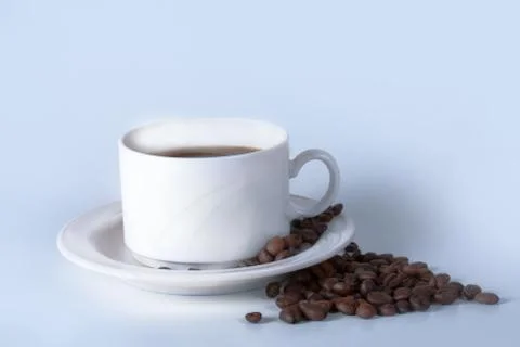 Coffee cup and beans on old kitchen table. Top view with copyspa Stock Photos