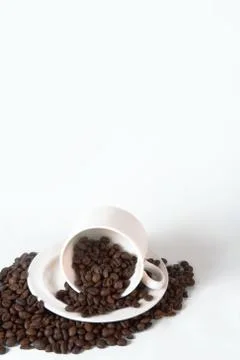 Coffee cup and beans on old kitchen table. Top view with copyspa Stock Photos