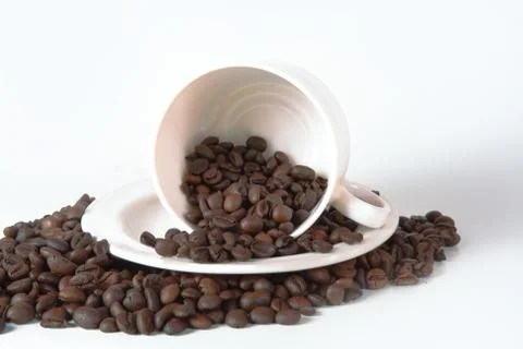 Coffee cup and beans on old kitchen table. Top view with copyspa Stock Photos