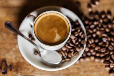 Coffee cup and beans Stock Photos
