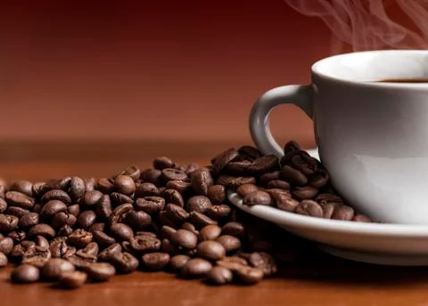 Coffee cup and beans Stock Photos