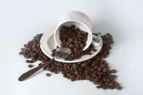 Coffee cup and beans. Stock Photos