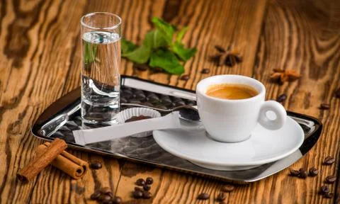 Coffee cup and  beans on table Stock Photos
