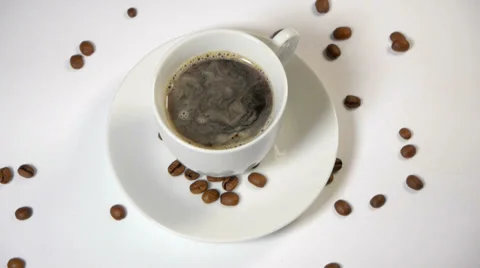 Coffee cup and beans on a white background. Stock Footage 37103385