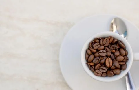 Coffee cup and beans on a white background. Top view with copy space for your 写真素材