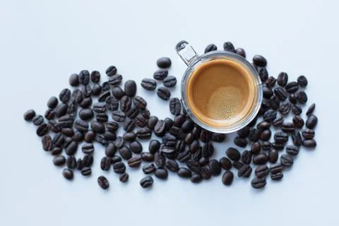 Coffee cup and beans on a white background. Stock Photos
