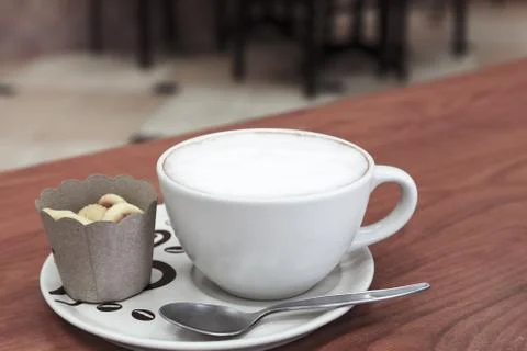 Coffee cup and bread on table Foto stock