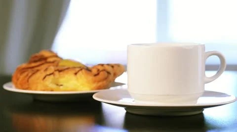 Coffee cup and bun Stock Footage 11848192
