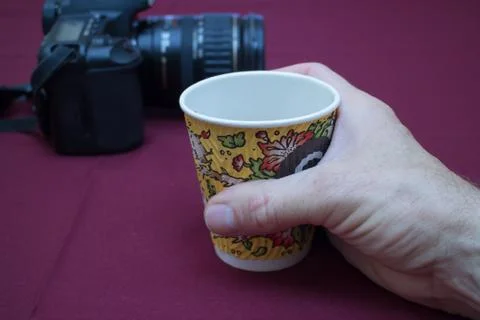 Coffee cup and camera Stock Photos