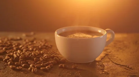Coffee cup and coffee beans on texture table Stock Footage 65738346