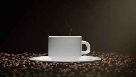 Coffee Cup and coffee beans. White Cup of steaming coffee with roasted beans Stock Footage 95428065